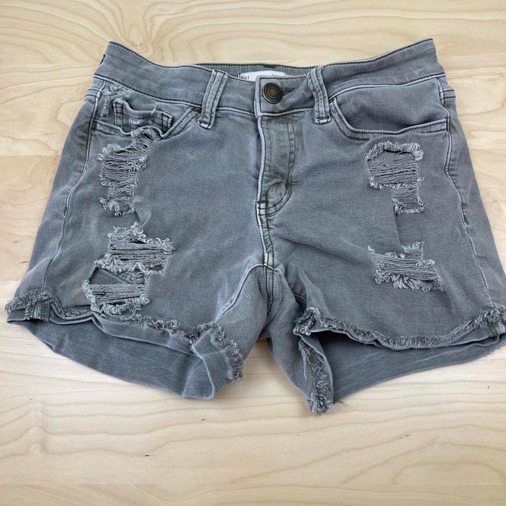 Low rise olive green denim shorts with distressed details, size 0